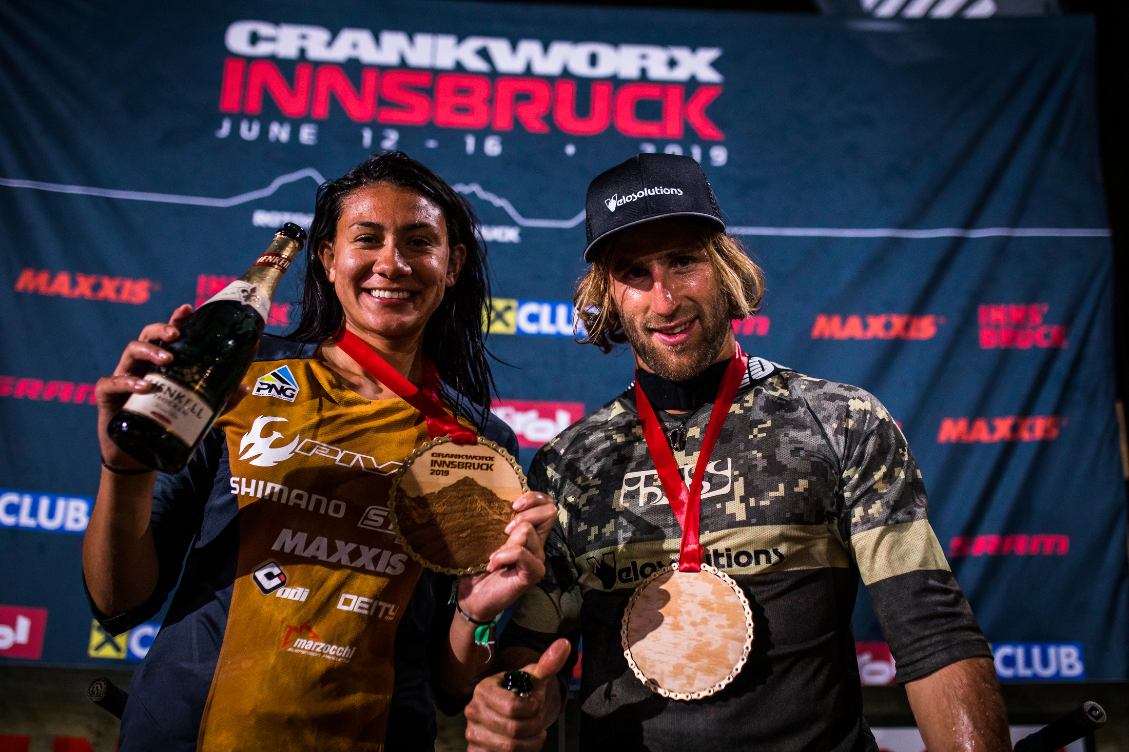 Kialani Hines and Adrien Loron pose for a photo after the victory celebration. Crankworx Innsbruck 2019.